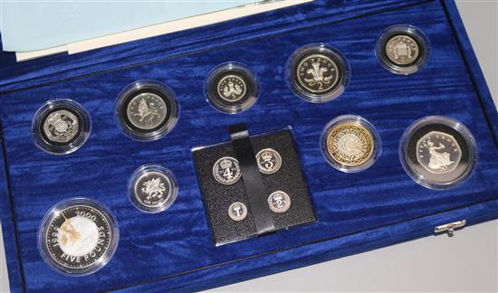 A cased Royal Mint Millennium silver collection 5p to £5 and maundy 1p-4p